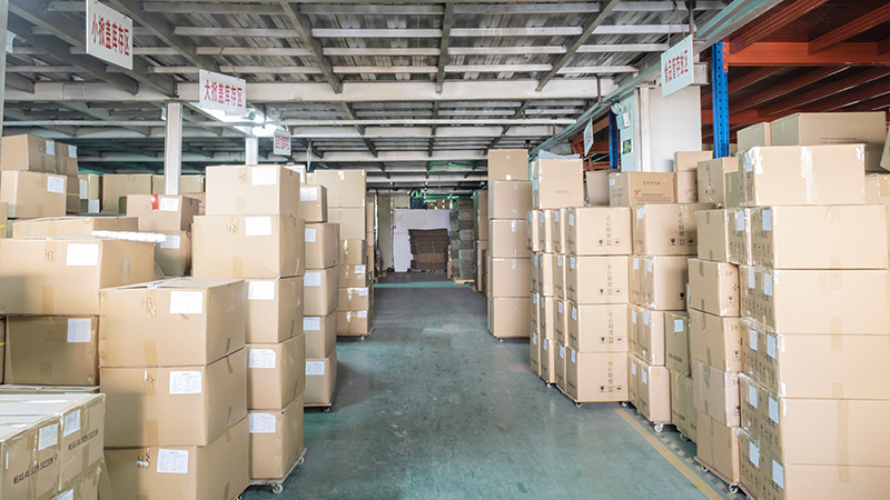 Warehouse storing wholesale plastic cosmetic tubes, featuring eco - friendly and customizable makeup tubes Warehouse stacked with boxes of wholesale plastic cosmetic tubes, including eco - friendly and customizable types