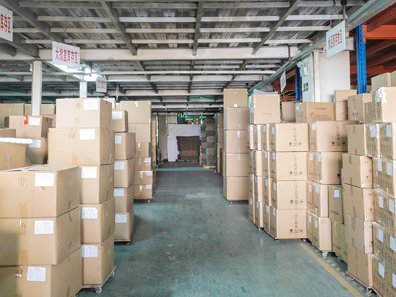Warehouse storing boxes of cosmetic jars, plastic containers for skincare packaging Warehouse storage area with stacked boxes, likely containing cosmetic jars and plastic containers